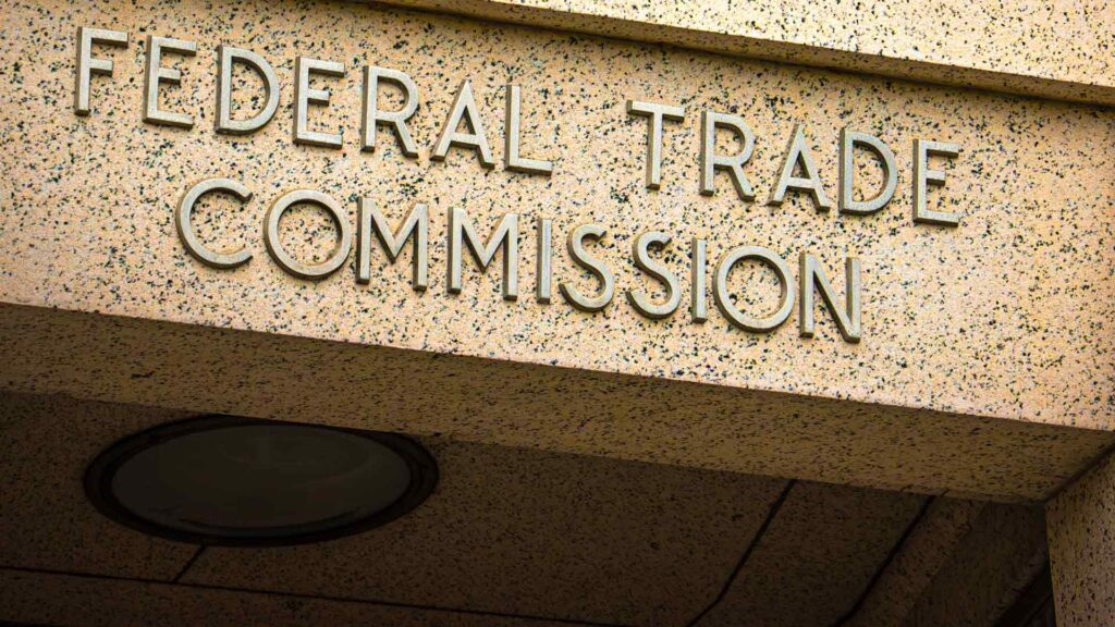 Photo of brass letters on granite above the doorway of the Federal Trade Commission in Washington, DC